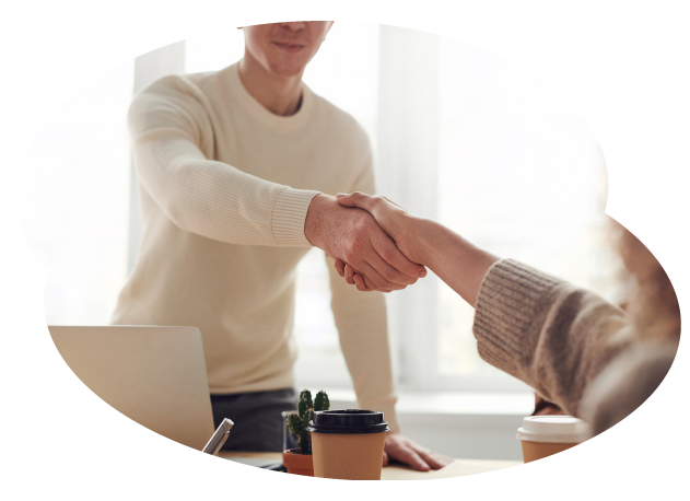 An apprenticeships learner shaking hands with an employer